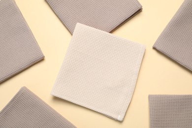 Photo of Clean waffle towels on beige background, flat lay