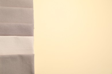 Photo of Clean waffle towels on beige background, flat lay. Space for text