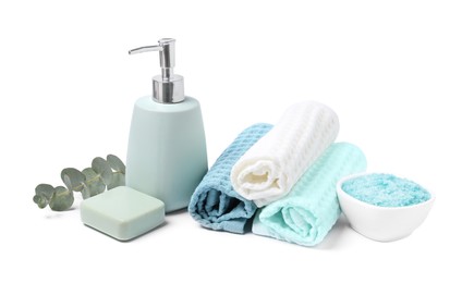 Photo of Clean waffle towels and cosmetic products isolated on white