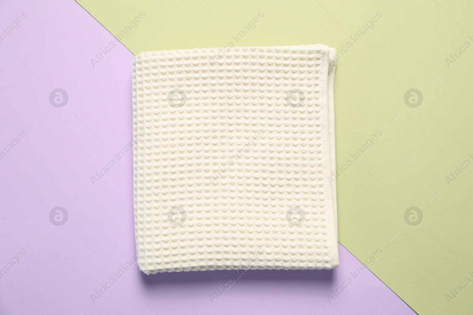 Clean waffle towel on color background, top view Photo of Clean waffle towel on color background, top view