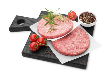 Photo of Fresh raw patties for burger, tomatoes and spices isolated on white