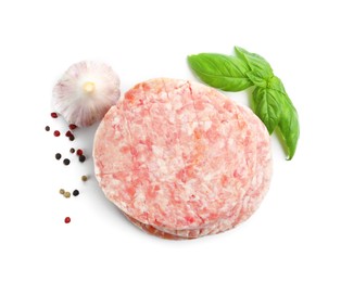 Photo of Fresh raw patties for burger and spices isolated on white, top view