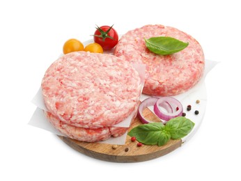 Photo of Fresh raw patties for burger, tomatoes and spices isolated on white