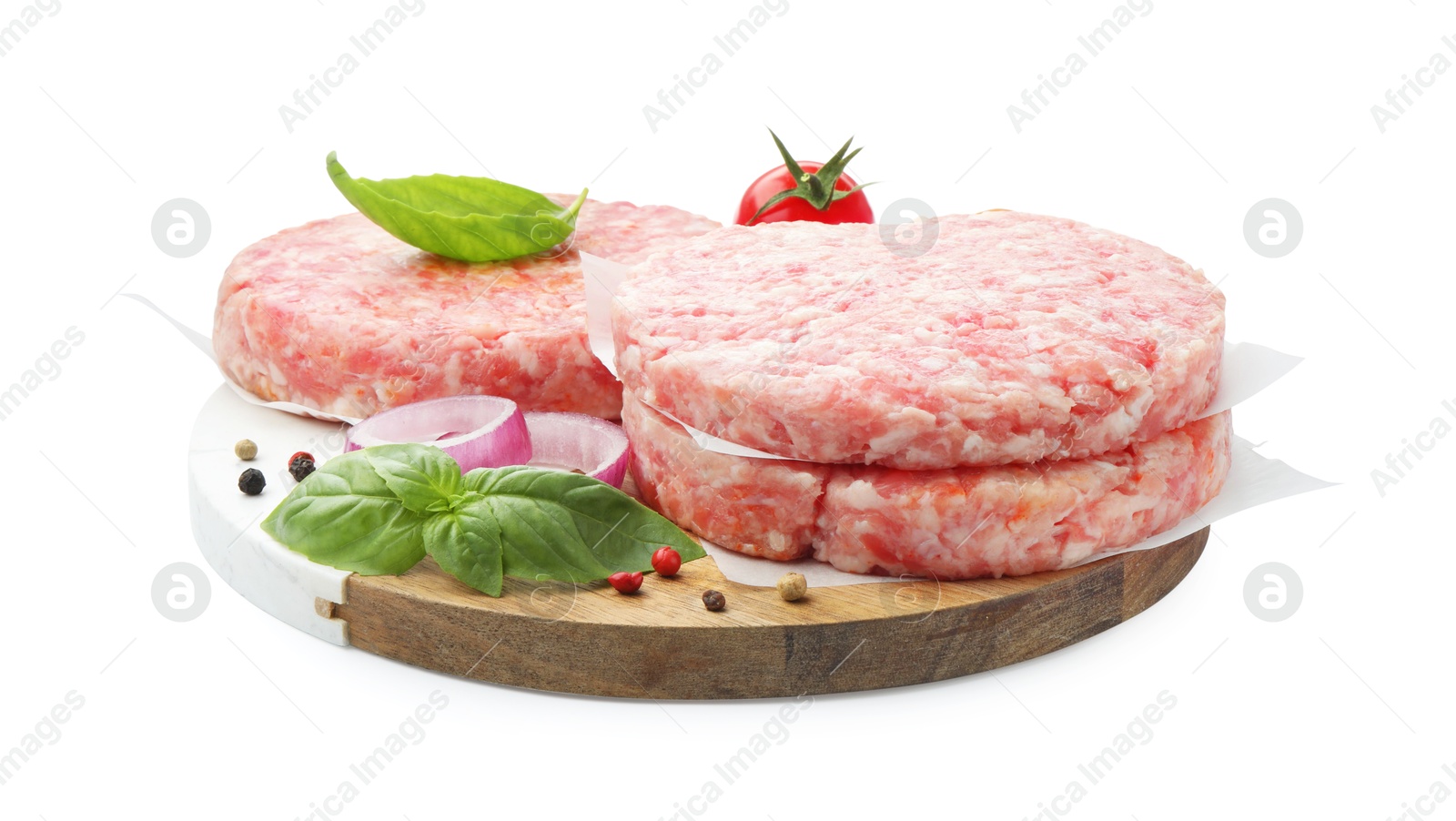 Fresh raw patties for burger, tomato and spices isolated on white Photo of Fresh raw patties for burger, tomato and spices isolated on white