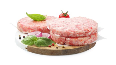 Photo of Fresh raw patties for burger, tomato and spices isolated on white