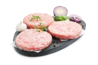 Photo of Fresh raw patties for burger and spices isolated on white