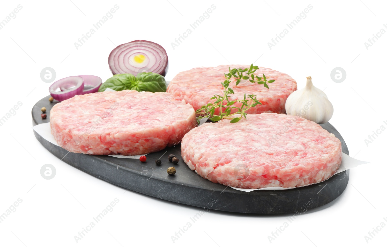 Fresh raw patties for burger and spices isolated on white Photo of Fresh raw patties for burger and spices isolated on white