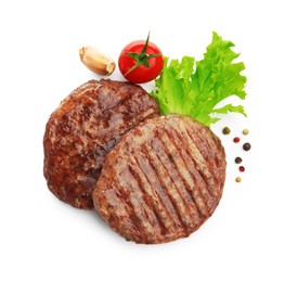 Photo of Delicious hamburger patties, tomato and spices isolated on white, top view