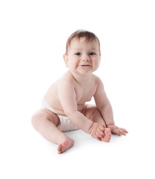 Photo of Cute little baby in diaper sitting on white background