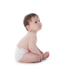 Photo of Cute little baby in diaper sitting on white background