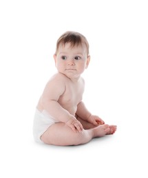 Photo of Cute little baby in diaper sitting on white background