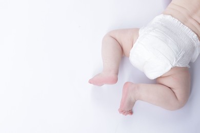 Photo of Cute little baby crawling on white background, above view