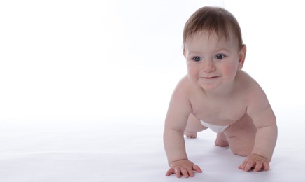 Photo of Cute little baby crawling on white background
