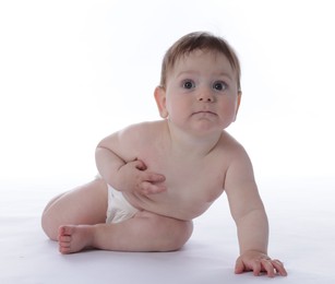 Photo of Cute little baby crawling on white background