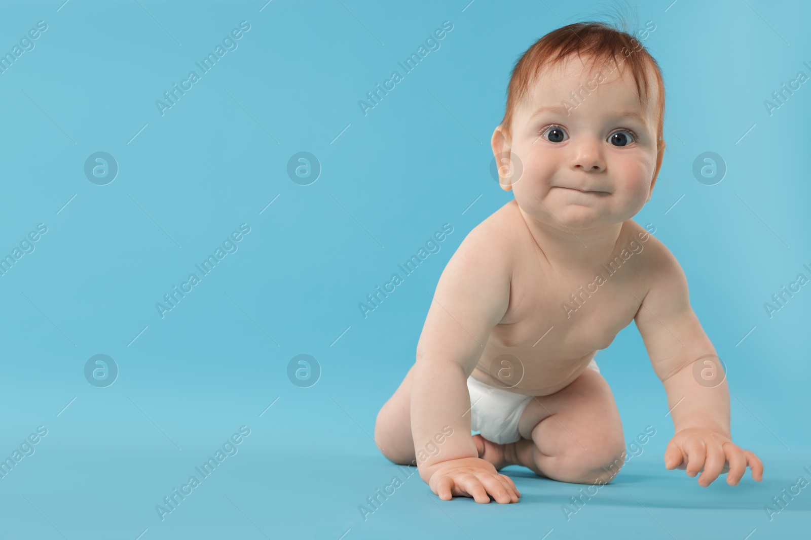 Cute little baby in diaper sitting on light blue background. Space for text Photo of Cute little baby in diaper sitting on light blue background. Space for text