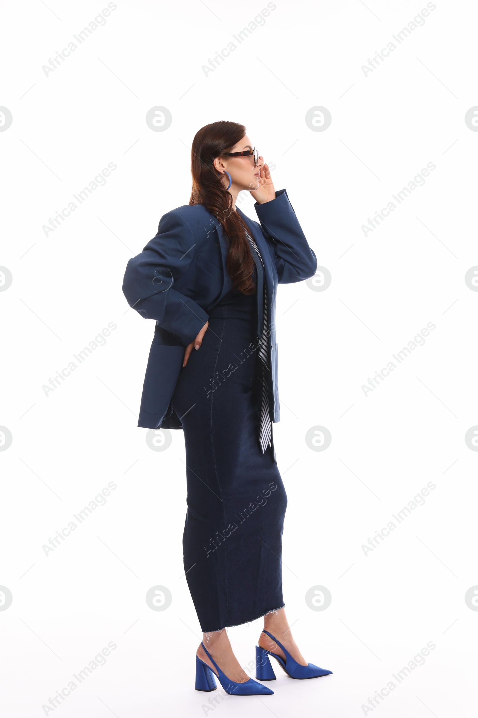 Young woman in stylish clothes on white background Photo of Young woman in stylish clothes on white background