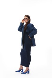 Photo of Young woman in stylish clothes on white background