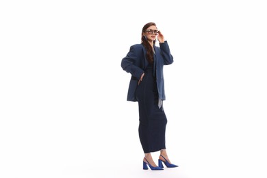 Photo of Young woman in stylish clothes on white background