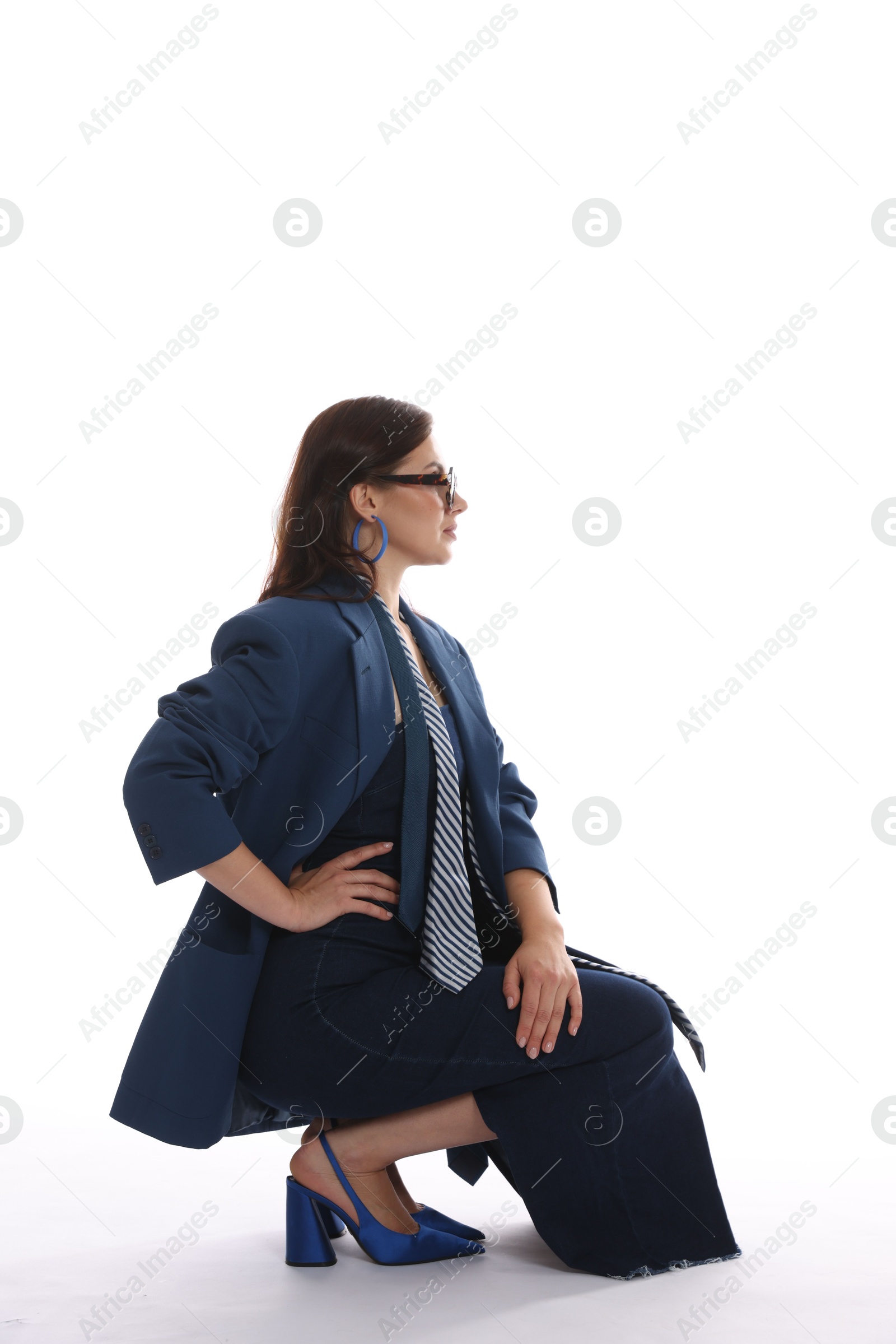 Young woman in stylish clothes on white background Photo of Young woman in stylish clothes on white background