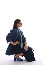 Photo of Young woman in stylish clothes on white background