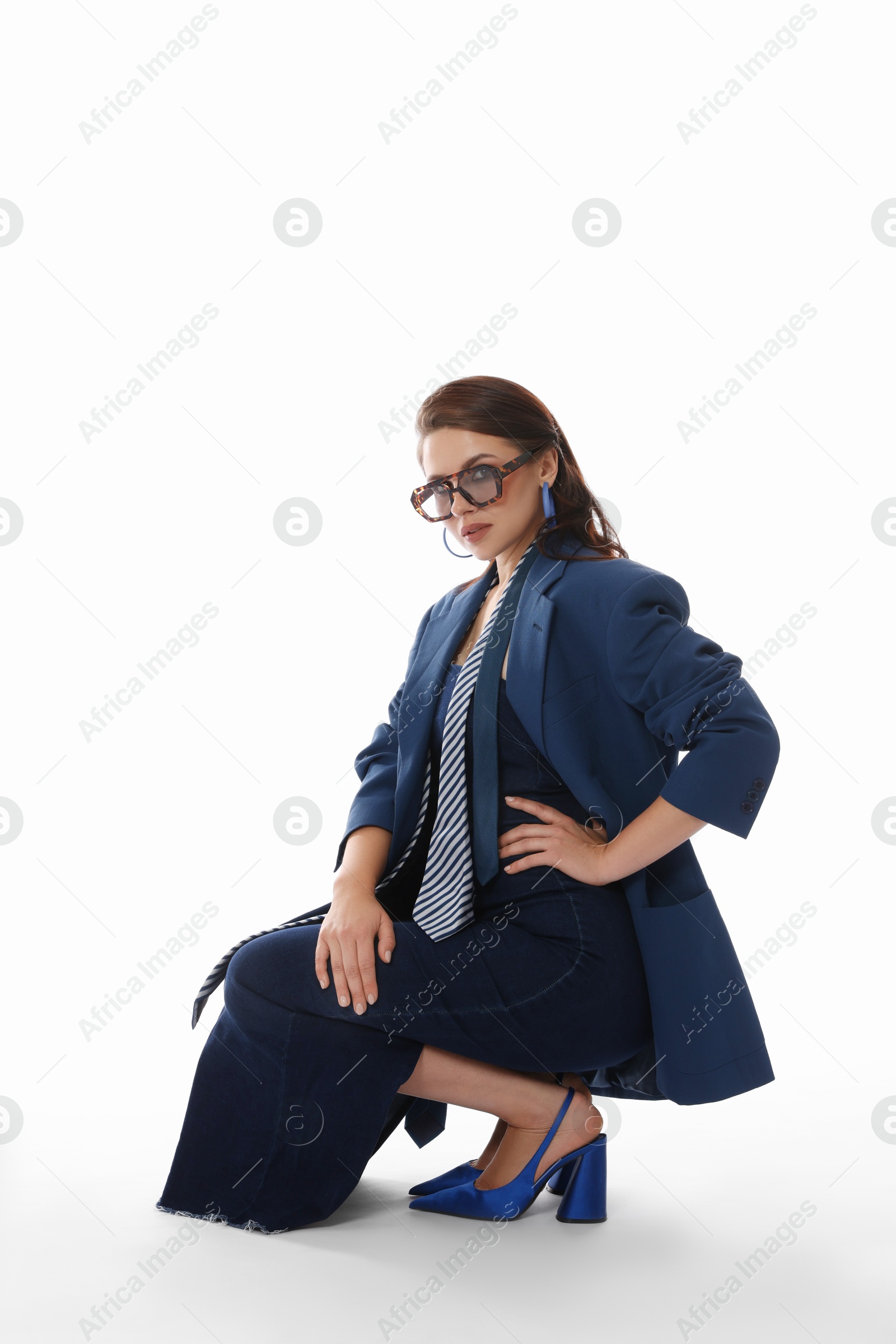 Young woman in stylish clothes on white background Photo of Young woman in stylish clothes on white background