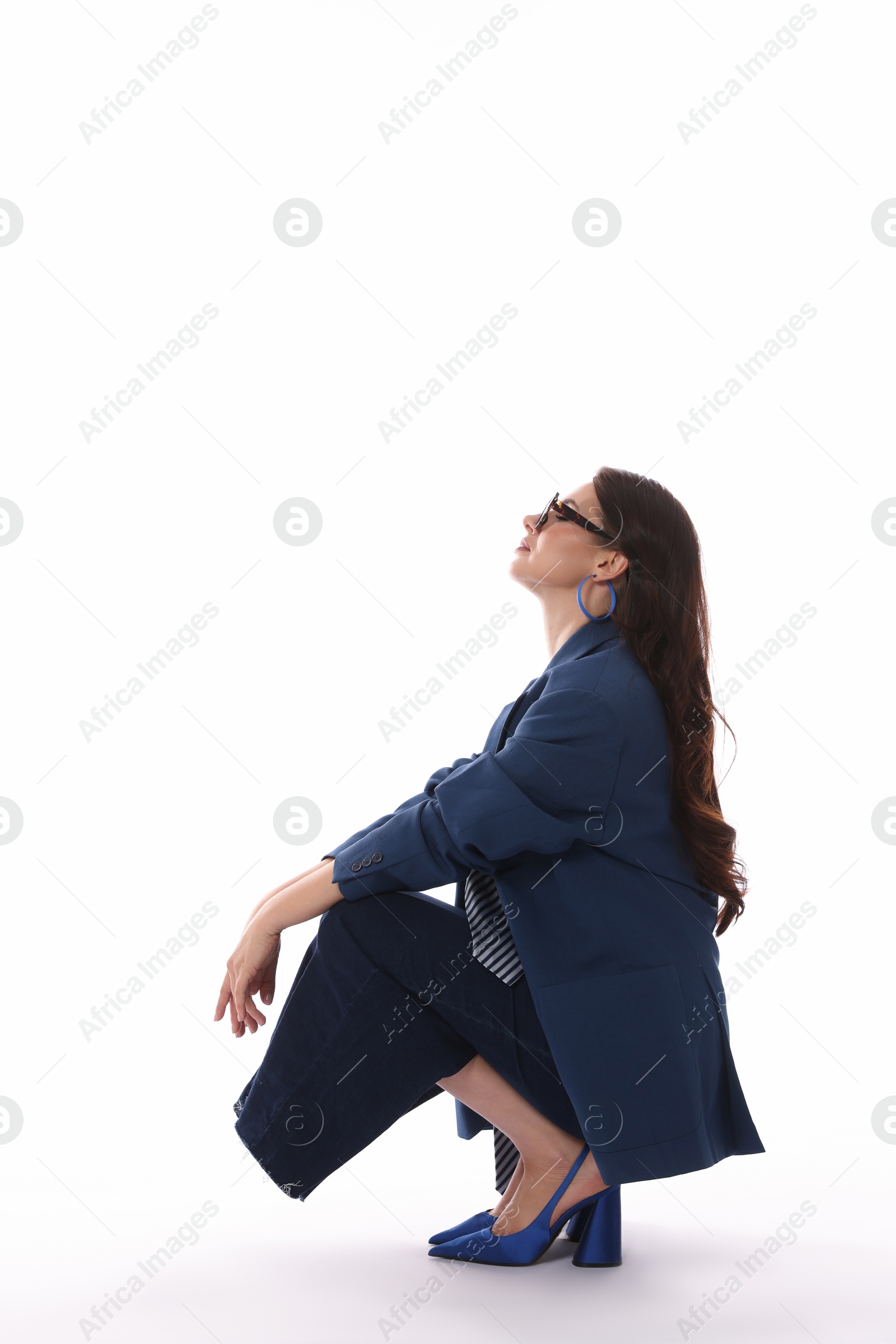 Young woman in stylish clothes on white background Photo of Young woman in stylish clothes on white background