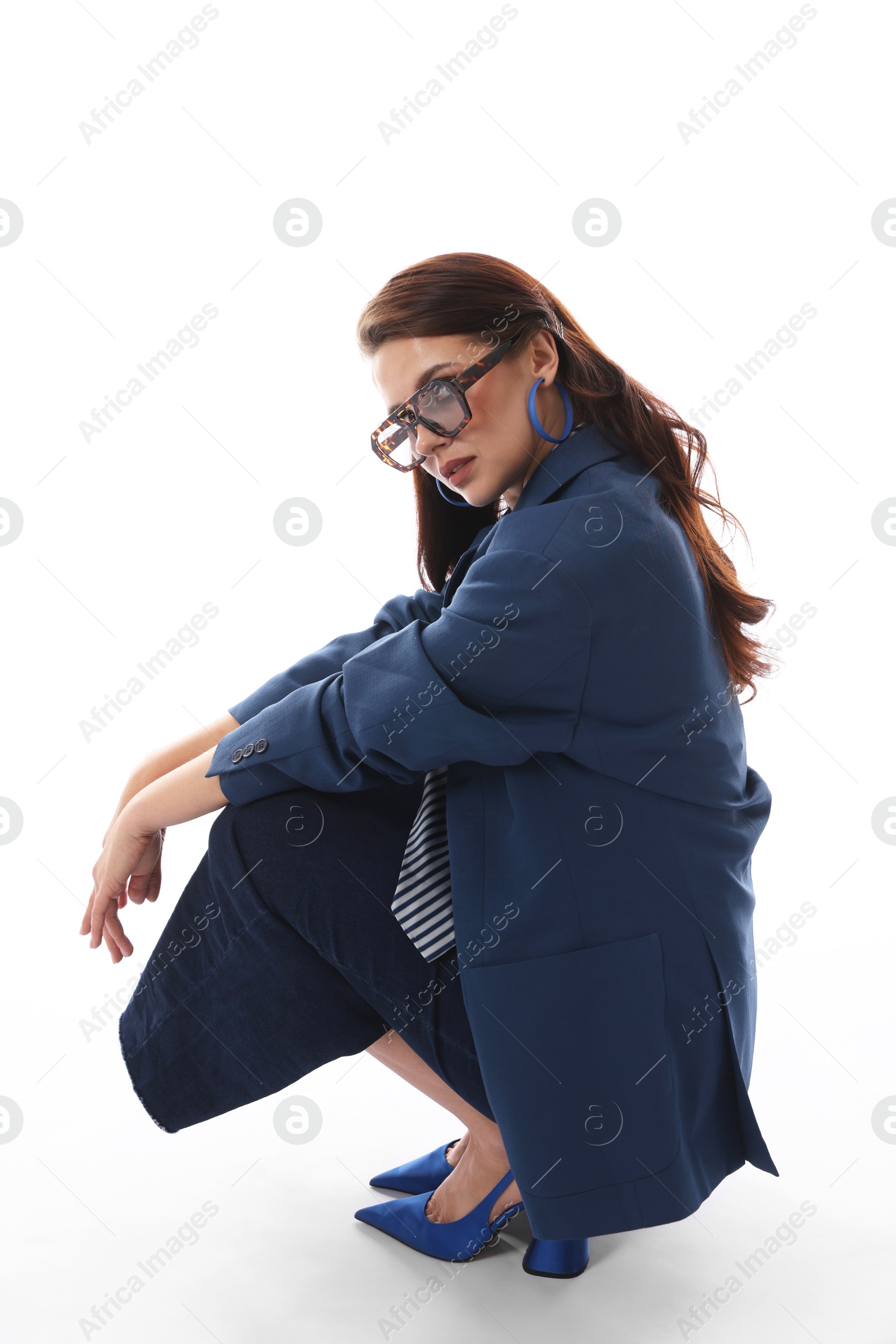 Young woman in stylish clothes on white background Photo of Young woman in stylish clothes on white background
