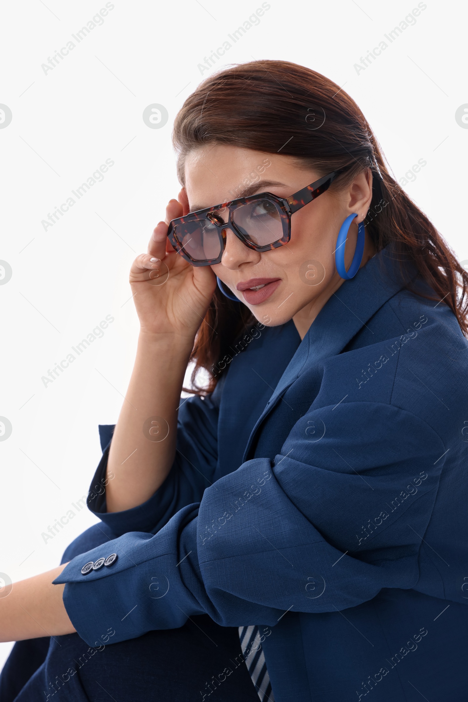 Young woman in stylish clothes on white background Photo of Young woman in stylish clothes on white background