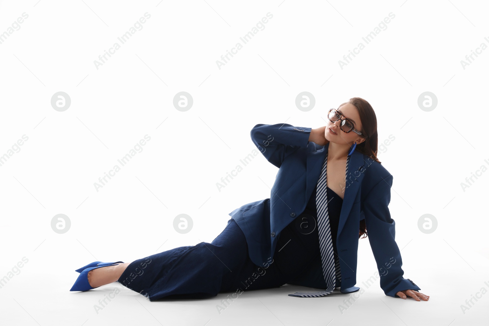 Young woman in stylish clothes on white background Photo of Young woman in stylish clothes on white background
