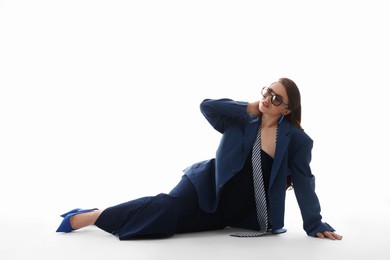 Photo of Young woman in stylish clothes on white background