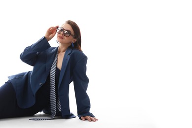Photo of Young woman in stylish clothes on white background, space for text