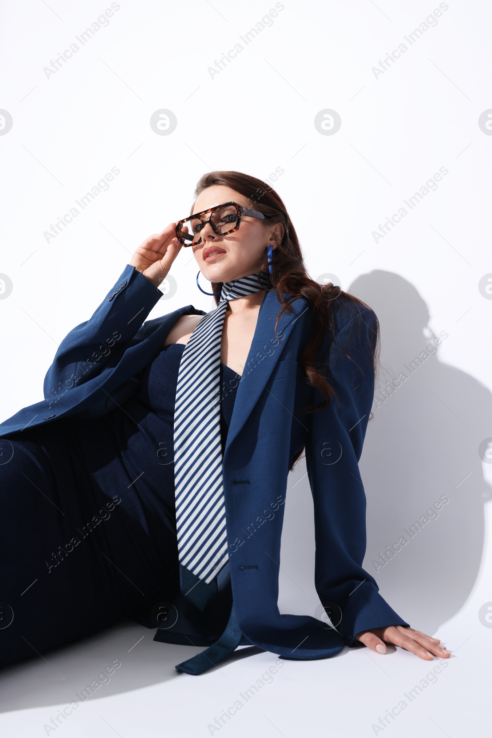 Young woman in stylish clothes on white background Photo of Young woman in stylish clothes on white background