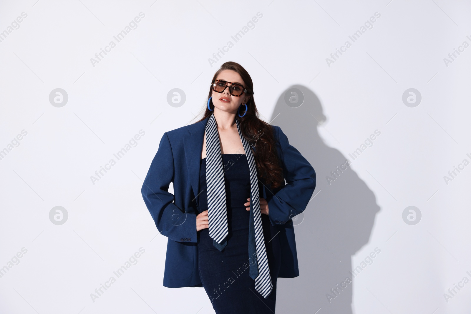 Young woman in stylish clothes on white background Photo of Young woman in stylish clothes on white background