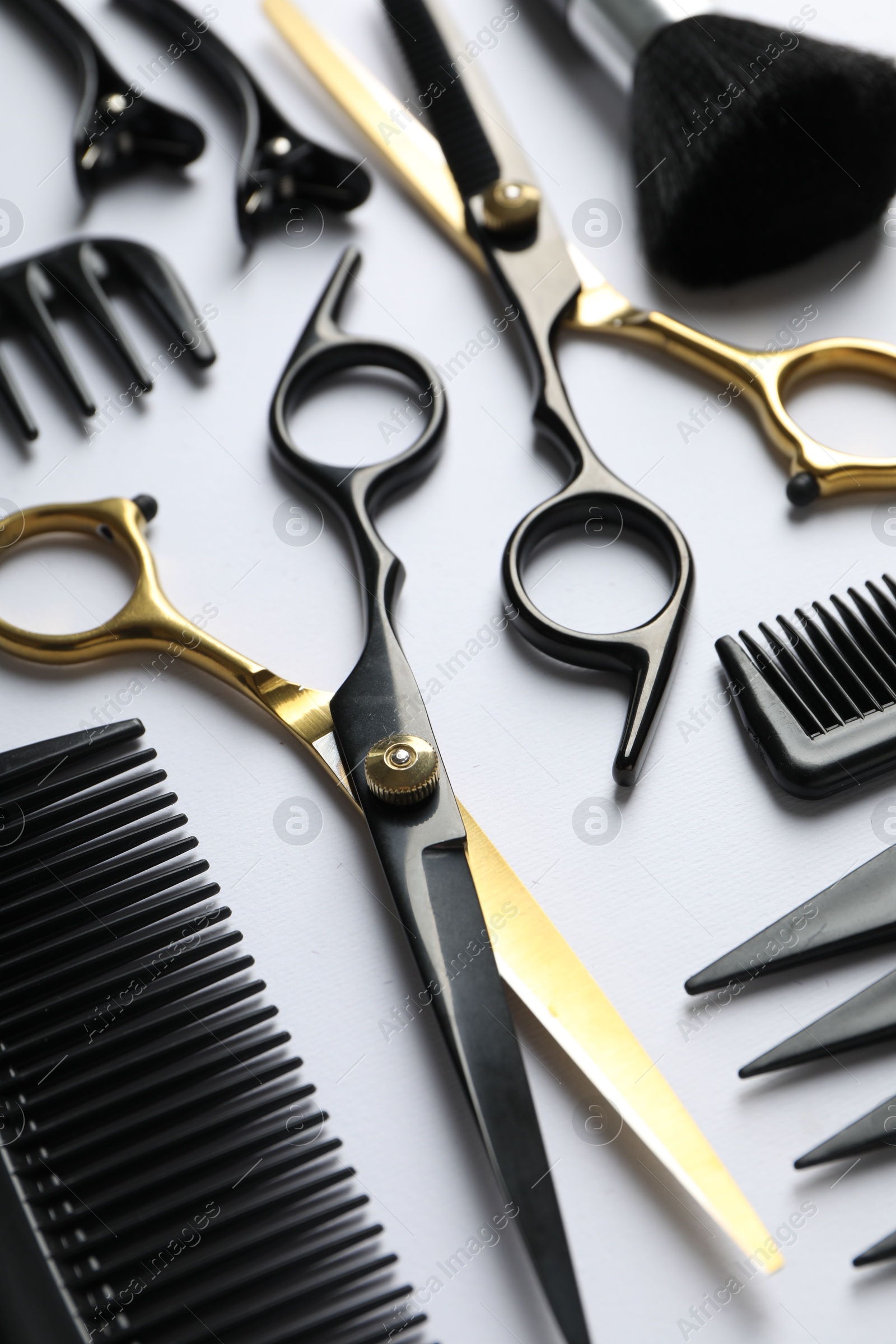 Different hairdresser's tools on white background, closeup Photo of Different hairdresser's tools on white background, closeup