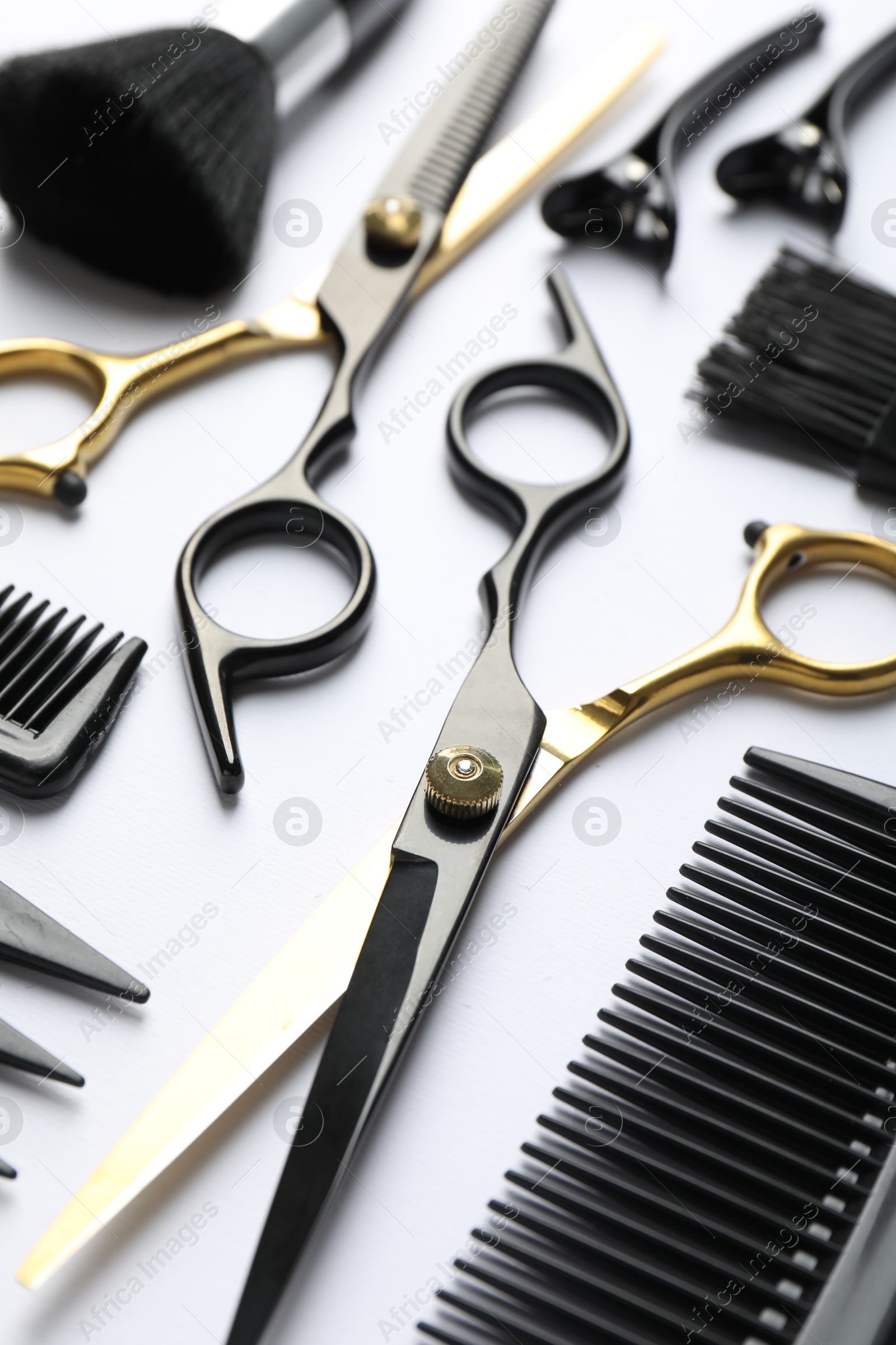 Different hairdresser's tools on white background, closeup Photo of Different hairdresser's tools on white background, closeup