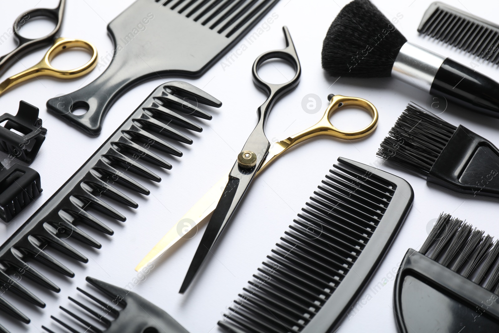 Different hairdresser's tools on white background, closeup Photo of Different hairdresser's tools on white background, closeup
