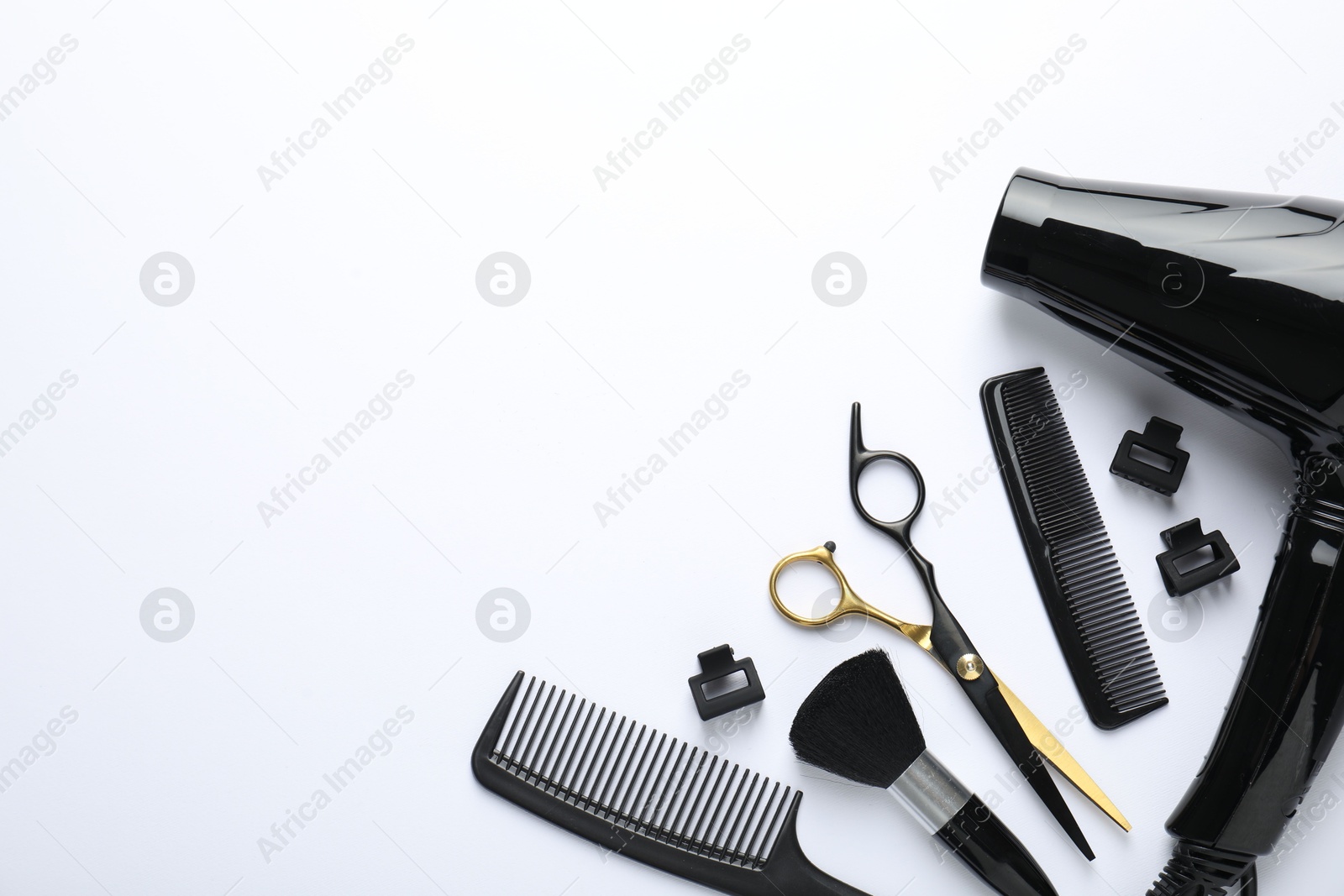 Different hairdresser's tools on white background, flat lay. Space for text Photo of Different hairdresser's tools on white background, flat lay. Space for text