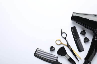 Photo of Different hairdresser's tools on white background, flat lay. Space for text