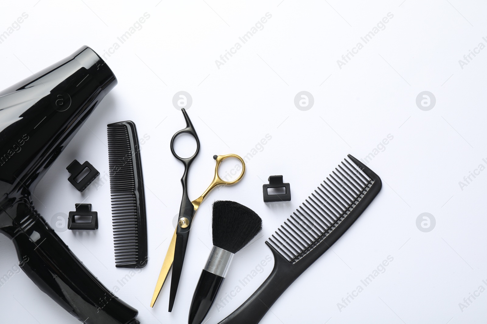 Different hairdresser's tools on white background, flat lay. Space for text Photo of Different hairdresser's tools on white background, flat lay. Space for text