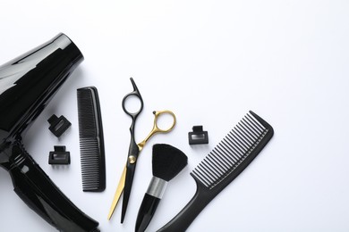Photo of Different hairdresser's tools on white background, flat lay. Space for text