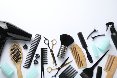 Photo of Different hairdresser's tools on white background, flat lay. Space for text