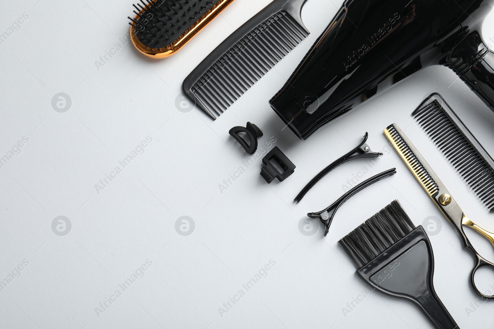 Different hairdresser's tools on white background, flat lay. Space for text Photo of Different hairdresser's tools on white background, flat lay. Space for text