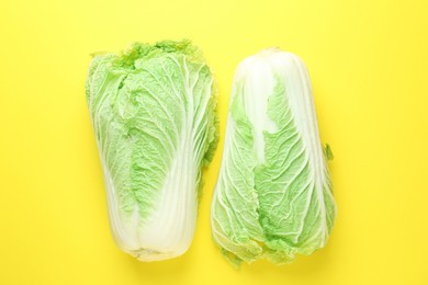 Photo of Fresh Chinese cabbages on yellow background, top view
