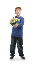 Photo of Boy with bouquet of beautiful lily-of-the-valley flowers on white background