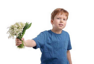 Photo of Boy with bouquet of beautiful lily-of-the-valley flowers on white background