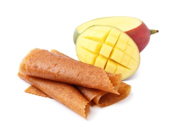 Photo of Delicious fruit leather rolls and mango isolated on white