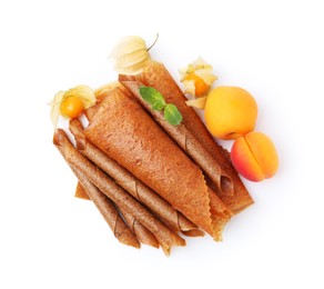 Photo of Delicious fruit leather rolls, mint, apricots and physalis isolated on white, top view