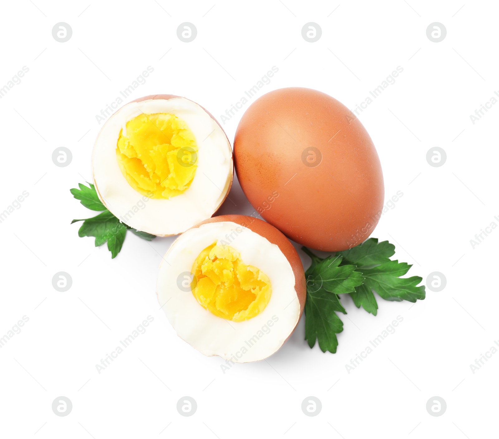 Photo of Hard boiled eggs and parsley on white background, top view