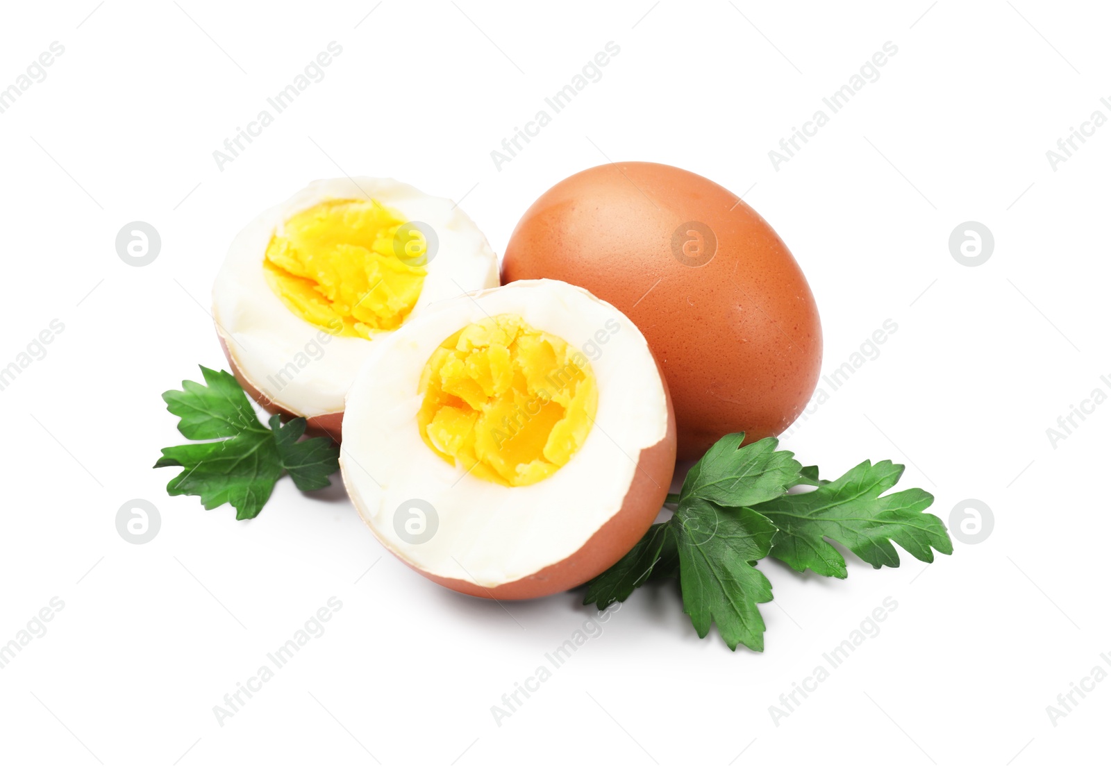 Photo of Hard boiled eggs and parsley on white background
