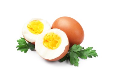 Photo of Hard boiled eggs and parsley on white background